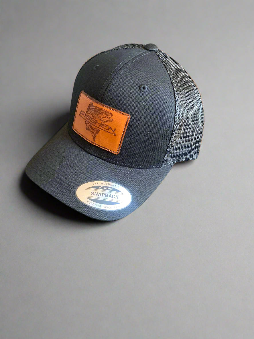 black trucker snap back hat with leather patch Fisshen trout logo