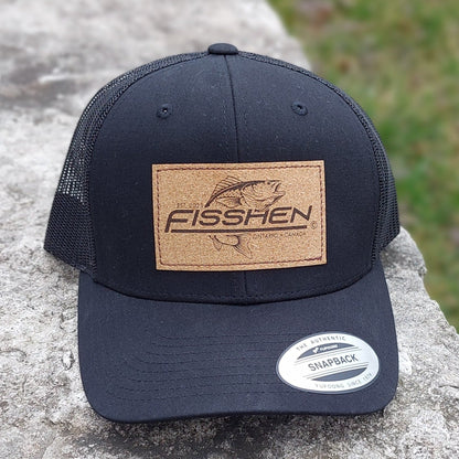 Fishing design with the word Fisshen. Trout image on a cork patch. Hat is black front and back