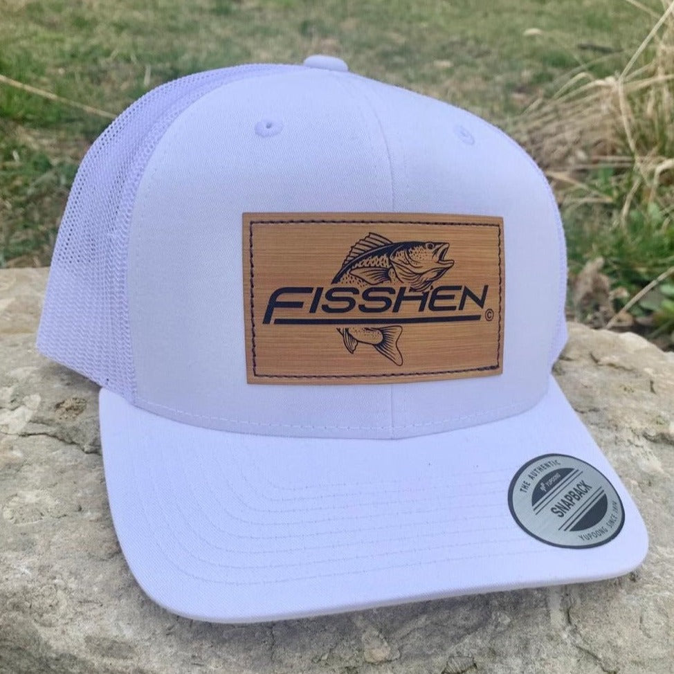 Fishing design with the word Fisshen. Trout image on a bamboo patch. Hat is white front and back.