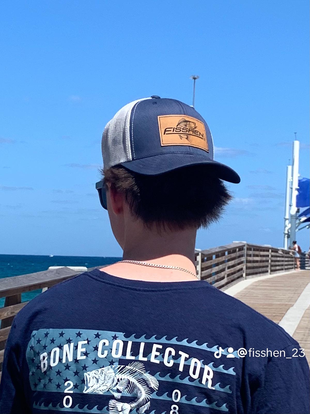 Youth wearing Blue meshback Trucker Hat with Bamboo Fisshen Co. patch